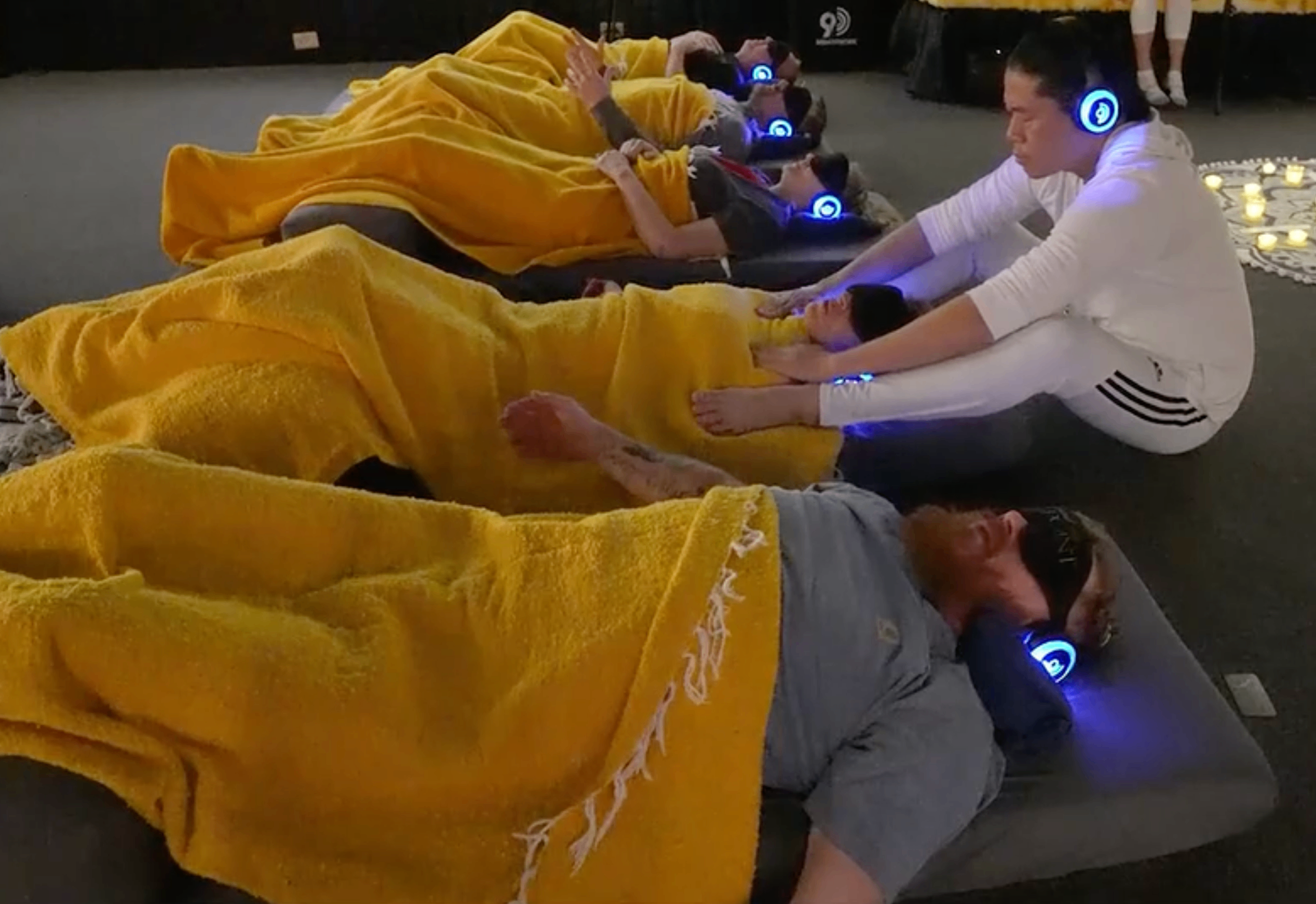 Facilitator supporting guests in a group breathwork session
